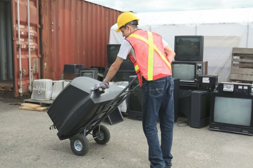 Recycling symbols and sorting signage at a commercial depot